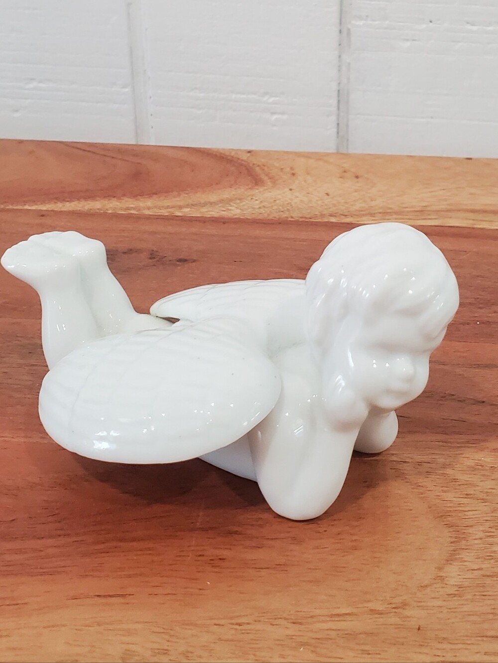 Vintage Angel Cherub White Ceramic Figurine Laying Down Long Wings